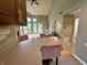Inviting kitchen with breakfast bar overlooking the living area with vaulted ceilings and natural light at 2829 Somerset Bay, Indianapolis, IN 46240