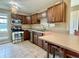 Stylish kitchen features stainless steel appliances, ample cabinet space, and breakfast bar at 2829 Somerset Bay, Indianapolis, IN 46240