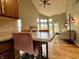 Open-concept living space with vaulted ceilings, a fireplace, and a seamless flow from kitchen to living area at 2829 Somerset Bay, Indianapolis, IN 46240