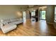 Open-concept living room with hardwood floors that flows into the kitchen and entryway at 2829 Somerset Bay, Indianapolis, IN 46240