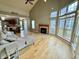 Sun-filled living room boasts vaulted ceilings, fireplace, and an open floorplan to kitchen at 2829 Somerset Bay, Indianapolis, IN 46240