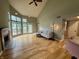 Bright living room features a fireplace, high ceilings, and large windows with lake view at 2829 Somerset Bay, Indianapolis, IN 46240