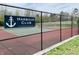 Harbour Club tennis courts with a Harbour Club sign, surrounded by a chain link fence and lush trees at 2829 Somerset Bay, Indianapolis, IN 46240