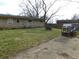 Spacious backyard with lawn, fence and mature trees at 2867 S Oakland Dr, Shelbyville, IN 46176