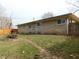 The backyard features a mix of green space and trees providing privacy and space to relax at 2867 S Oakland Dr, Shelbyville, IN 46176