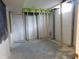Unfinished basement featuring framed walls, plastic sheeting, and a concrete floor at 2867 S Oakland Dr, Shelbyville, IN 46176