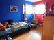 bedroom with blue and red walls and a hanging swing at 2867 S Oakland Dr, Shelbyville, IN 46176