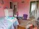 Bright pink bedroom featuring a hanging chair and storage dresser at 2867 S Oakland Dr, Shelbyville, IN 46176
