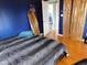 Comfortable bedroom with a mirror and view to the bathroom at 2867 S Oakland Dr, Shelbyville, IN 46176