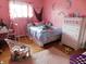 Cozy bedroom with whimsical decor and a hanging chair at 2867 S Oakland Dr, Shelbyville, IN 46176