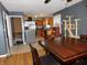 Dining area with wood floors next to the kitchen with space for the whole Gathering to gather at 2867 S Oakland Dr, Shelbyville, IN 46176