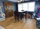 Dining area featuring wood floors, a large china cabinet and natural light from the window at 2867 S Oakland Dr, Shelbyville, IN 46176