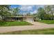 Charming single story home with a stone facade, mature trees and an attached two car garage at 2867 S Oakland Dr, Shelbyville, IN 46176
