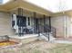 Inviting front porch with stone accents, providing a welcoming entrance to the home at 2867 S Oakland Dr, Shelbyville, IN 46176