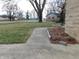 View of the front yard of the home showcasing landscaping and proximity to neighborhood at 2867 S Oakland Dr, Shelbyville, IN 46176
