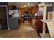 Well-equipped kitchen featuring wood cabinets, tile flooring and modern stainless steel appliances at 2867 S Oakland Dr, Shelbyville, IN 46176