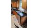 Well-lit kitchen featuring stainless steel appliances, countertops, and tile flooring at 2867 S Oakland Dr, Shelbyville, IN 46176