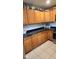Well-lit kitchen featuring stainless steel appliances, countertops, and tile flooring at 2867 S Oakland Dr, Shelbyville, IN 46176