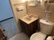 Cozy bathroom featuring a toilet, sink, vanity, and a neutral color scheme at 2927 E 8Th St, Anderson, IN 46012