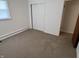 Empty bedroom features neutral walls, carpet and a window offering plenty of natural light at 2927 E 8Th St, Anderson, IN 46012