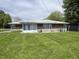 Single story home with a brick exterior and a well-maintained lawn at 2927 E 8Th St, Anderson, IN 46012