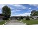 Charming one-story home featuring a well-maintained lawn and a long driveway at 2927 E 8Th St, Anderson, IN 46012