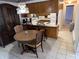 Eat-in kitchen featuring wood cabinets, white appliances, and room for a table at 2927 E 8Th St, Anderson, IN 46012