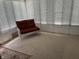 Inviting sunroom with a cushioned loveseat and large, bright windows at 2927 E 8Th St, Anderson, IN 46012
