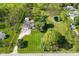 Aerial view of property highlighting house, pond, outbuildings, and surrounding landscape at 296 W Greencastle Rd, Mooresville, IN 46158