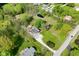 Aerial view of a beautiful home with a long driveway and manicured lawn leading to a serene private pond at 296 W Greencastle Rd, Mooresville, IN 46158