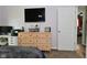 Open bedroom featuring a TV, dresser, doorway and a desk with workspace at 296 W Greencastle Rd, Mooresville, IN 46158