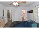 Bright bedroom with views to bathroom and closet with an updated ceiling fan at 296 W Greencastle Rd, Mooresville, IN 46158