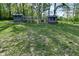 Backyard chicken coop featuring enclosed runs, offering a functional and sustainable outdoor space at 296 W Greencastle Rd, Mooresville, IN 46158
