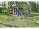 Backyard chicken coop featuring enclosed runs, offering a functional and sustainable outdoor space at 296 W Greencastle Rd, Mooresville, IN 46158
