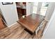 Bright dining area featuring wood-look floors, a wooden table, and seating for six at 296 W Greencastle Rd, Mooresville, IN 46158