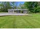 Single-story home with a front porch, manicured lawn, and mature trees at 296 W Greencastle Rd, Mooresville, IN 46158