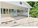 Charming covered front porch with a swing and turquoise front door at 296 W Greencastle Rd, Mooresville, IN 46158