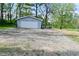 Detached single-car garage with a white door and gravel driveway, providing ample parking and storage at 296 W Greencastle Rd, Mooresville, IN 46158