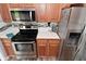 This kitchen features stainless appliances, wooden cabinets, and bright countertops at 296 W Greencastle Rd, Mooresville, IN 46158