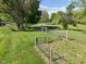 Scenic pasture view with wooden fencing surrounding a horse and lush green grass at 296 W Greencastle Rd, Mooresville, IN 46158