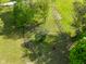 Aerial view of a horse grazing in a fenced pasture surrounded by green trees and lush grass at 296 W Greencastle Rd, Mooresville, IN 46158
