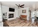Spacious living room with a fireplace, wood floors, and lots of natural light at 296 W Greencastle Rd, Mooresville, IN 46158