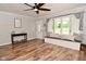 Inviting living room with built-in bench seating, wood floors, and ample light at 296 W Greencastle Rd, Mooresville, IN 46158
