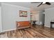 Inviting living room featuring wood floors, bench seating, and neutral paint at 296 W Greencastle Rd, Mooresville, IN 46158