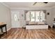 Bright living room featuring wood floors and a large window with bench seating at 296 W Greencastle Rd, Mooresville, IN 46158