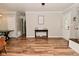 Open-concept living area with wood floors and a view of the front entrance at 296 W Greencastle Rd, Mooresville, IN 46158