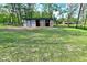 Image of a well maintained outbuilding with stalls and a horse in the background at 296 W Greencastle Rd, Mooresville, IN 46158