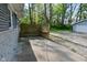 Back patio area with a wooden bench and lattice, offering a cozy outdoor space with privacy at 296 W Greencastle Rd, Mooresville, IN 46158