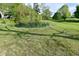 Scenic pond surrounded by lush greenery and grass, creating a tranquil outdoor space at 296 W Greencastle Rd, Mooresville, IN 46158