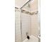 Modern shower with neutral tile, decorative accent band, and updated fixtures at 296 W Greencastle Rd, Mooresville, IN 46158